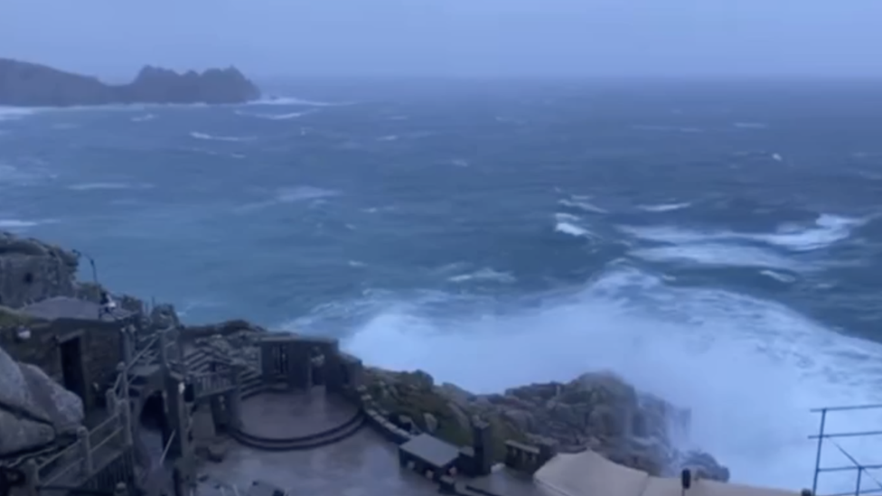 The Minack Theatre being hit by large waves