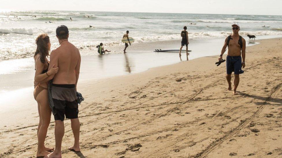 Tourists on a beach in Bali