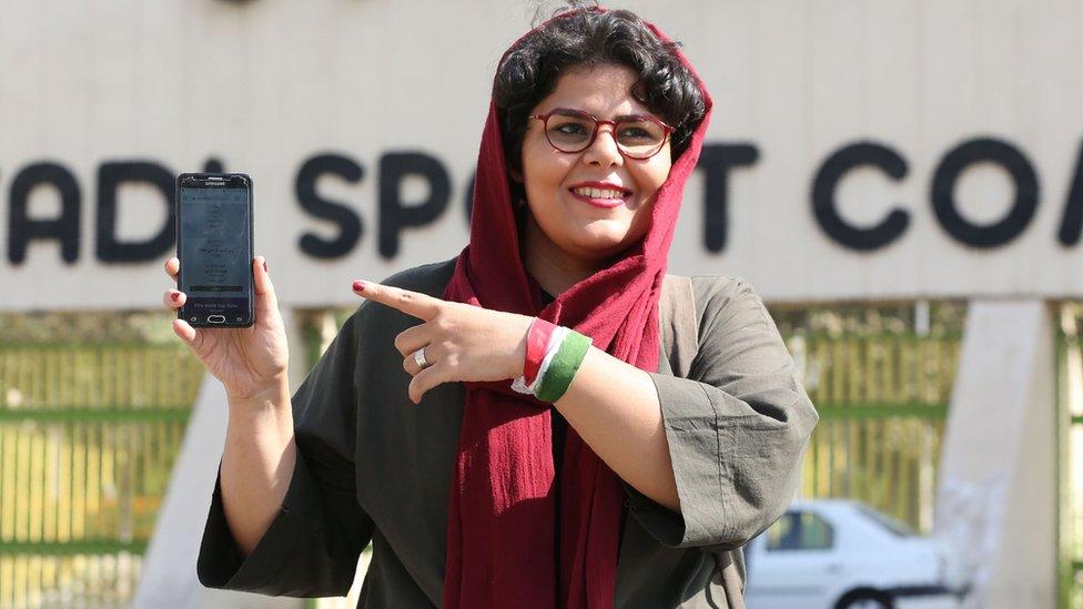 Iranian-journalist-shows-her-ticket-for-the-Iran-v-Cambodia-match