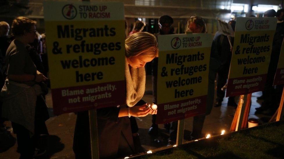 Campaigners attend a vigil outside the Home Office