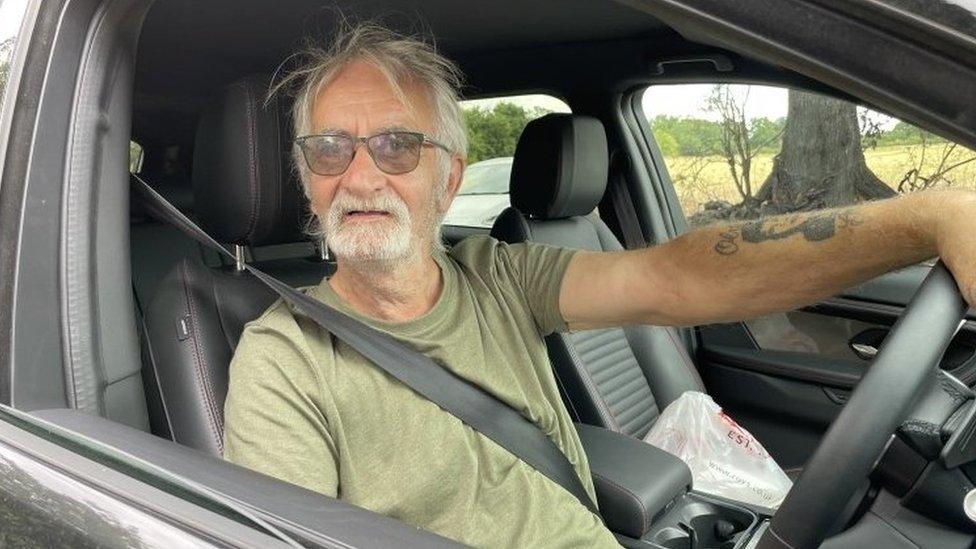 Keith Gant behind the wheel of a Land Rover