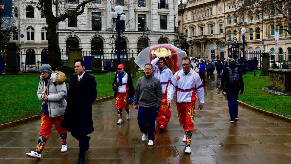 The Chinese lion team arrive at St Philip's