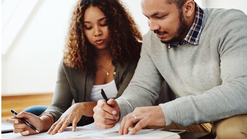 Couple going through paperwork generic