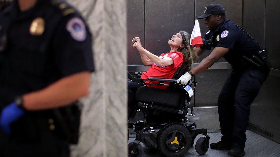 US Capitol Police arrest protesters who shouted and interrupted a Senate Finance Committee