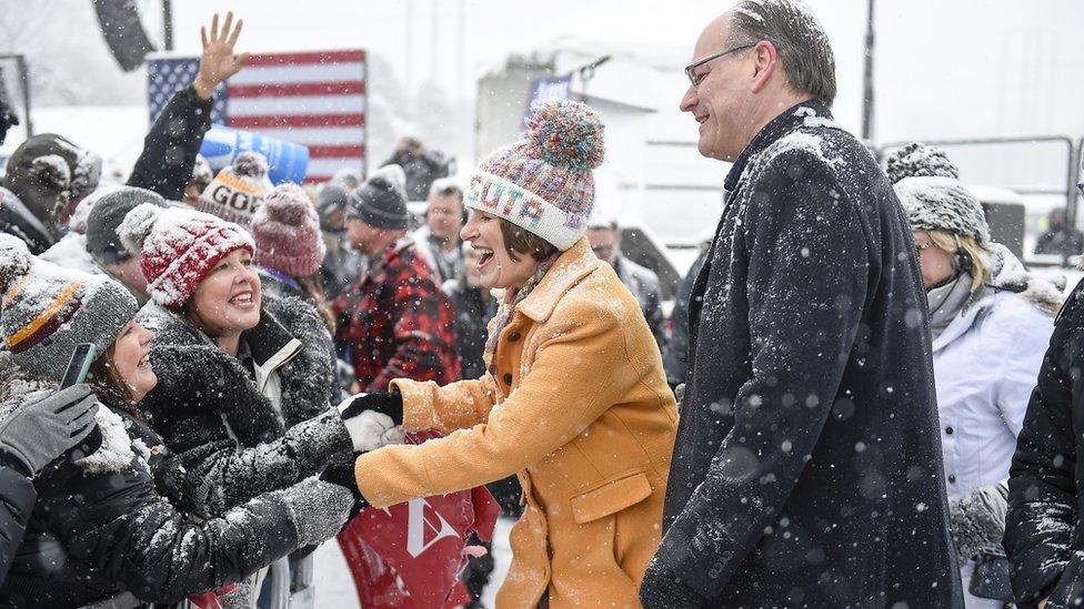 Democratic Senator of Minnesota Amy Klobuchar (L) shakes hands with supporters with her husband John Bessler (R) after she announced that she is running for President