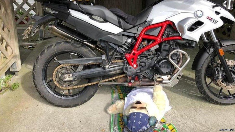 Chester the teddy bear trying to fix the family motorbike