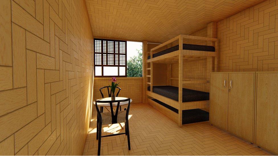 A bedroom featuring bunk beds, a table with chairs, and a tessellating tiling pattern on the bamboo walls