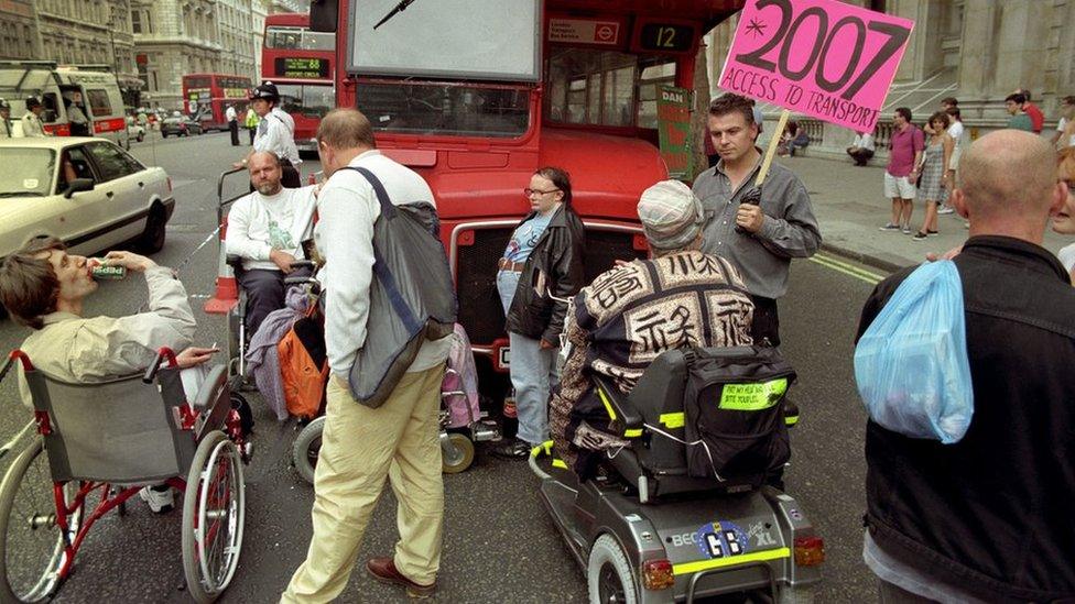 DAN hold up a bus outside Downing Street