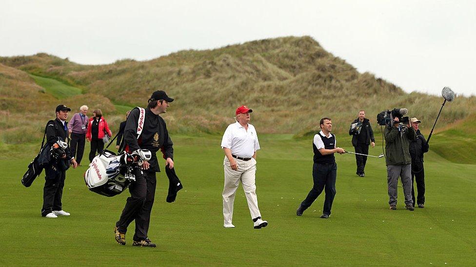 Donald Trump walks on his golf course in Balmedie, Scotland.