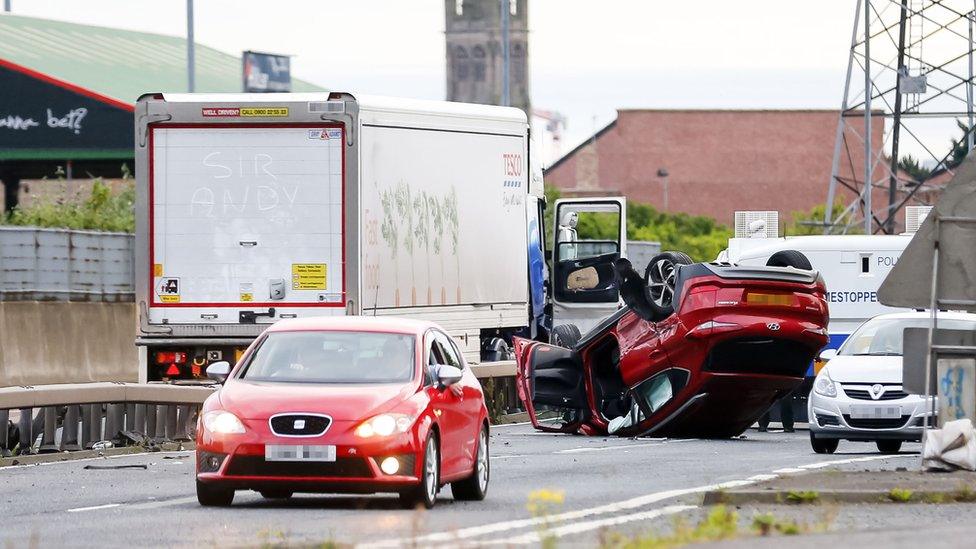 The car was on its roof after the crash on Sunday evening
