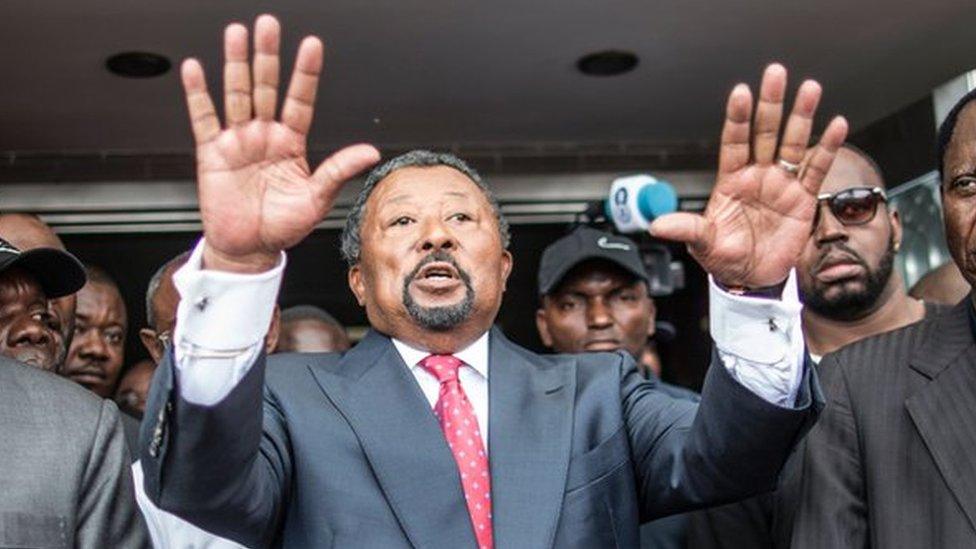 Jean Ping outside his party headquarters