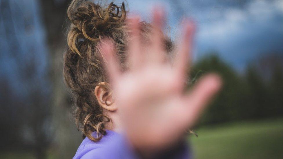 A stock image of someone who doesn't wish to be photographed