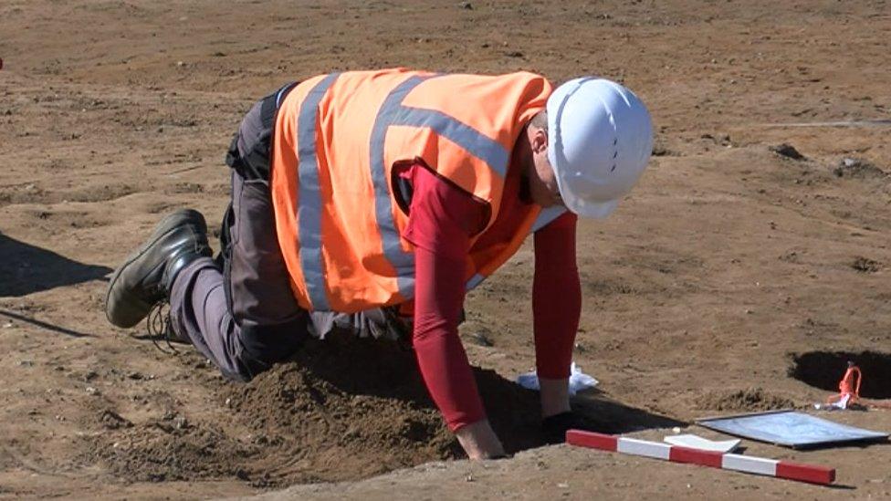 Archaeologists on the site