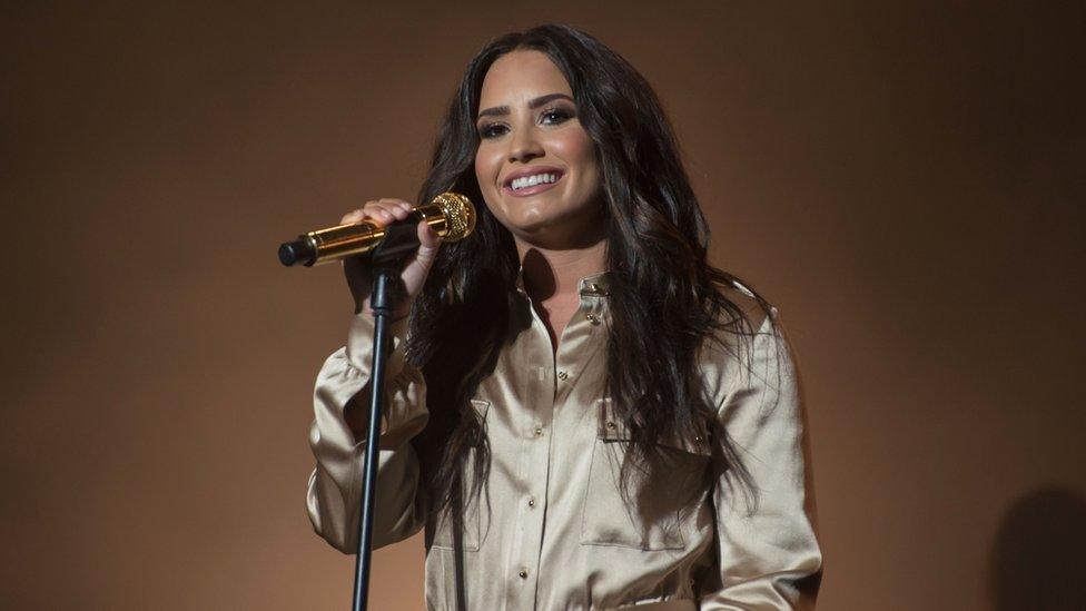 Lovato performing on stage in 2017 in Morocco