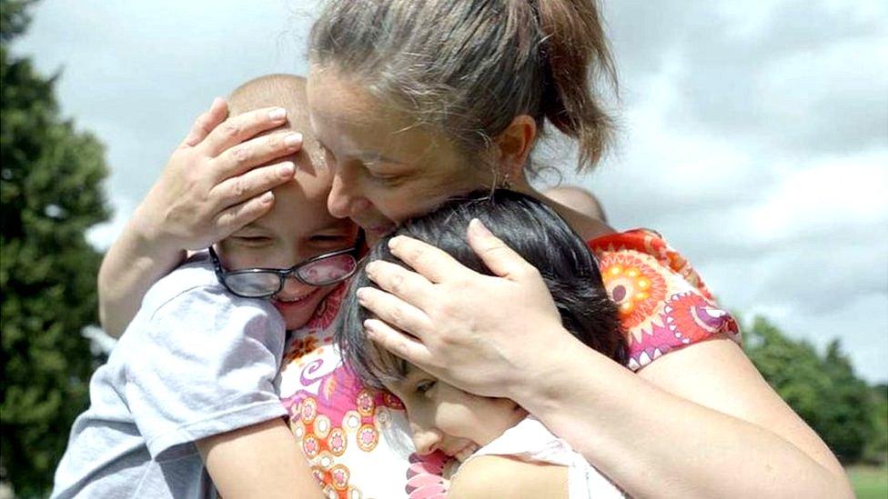 Olga reunited with two of her adopted children