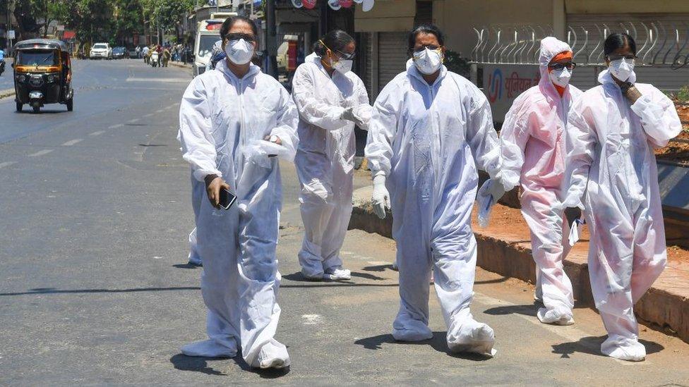 Health workers take a break in Mumbai