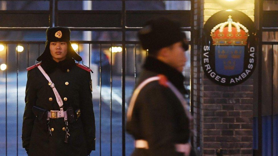 Chinese police outside the Swedish embassy in Beijing, 14 February