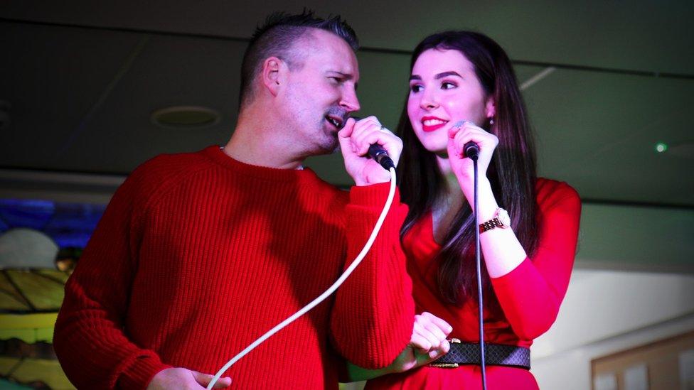 Beth and James Duke performing.