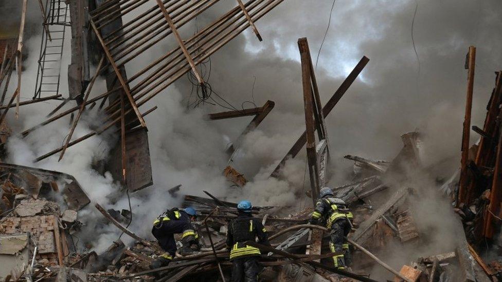 Rescuers search through the debris in Zaporizhzhia, southern Ukraine. Photo: 6 October 2022