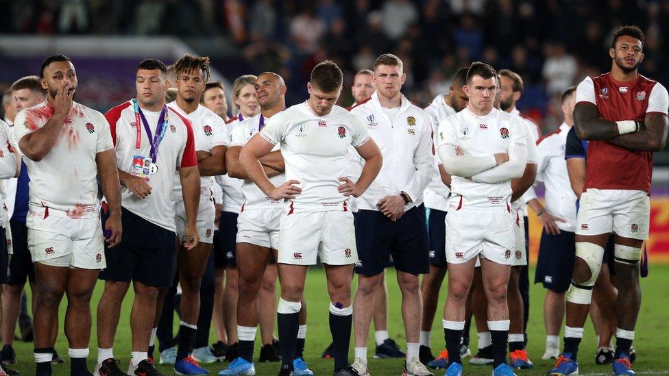 England captain Owen Farrell (centre) stand dejected with his team-mates after the 2019 Rugby World Cup final match at Yokohama Stadium.