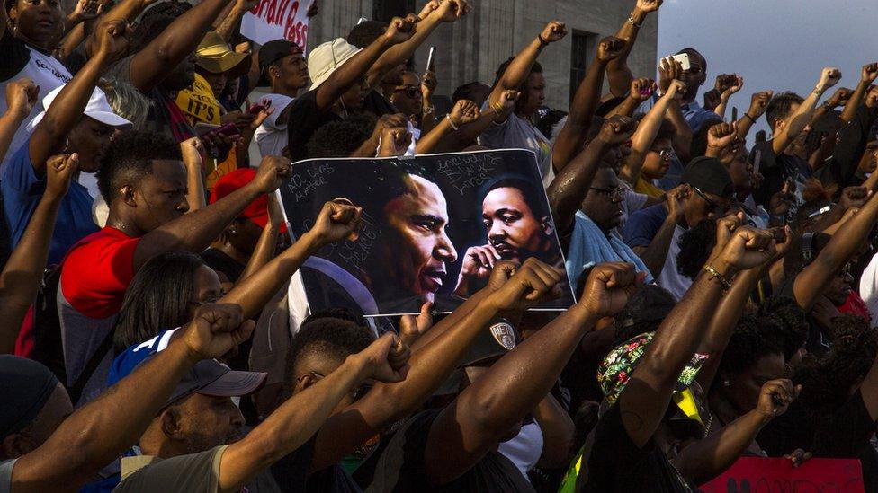 Demonstrators gather after marching at the Louisiana Capitol to protest the shooting of Alton Sterling on July 9, 2016 in Baton Rouge, Louisiana.