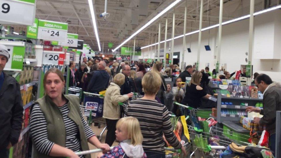 Customers shopping in Norwich's Asda