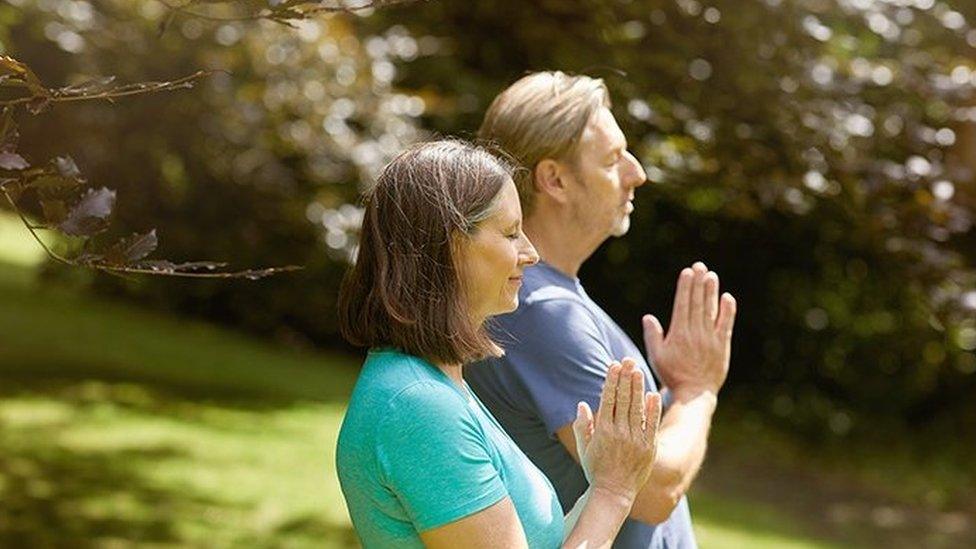 People practicing yoga