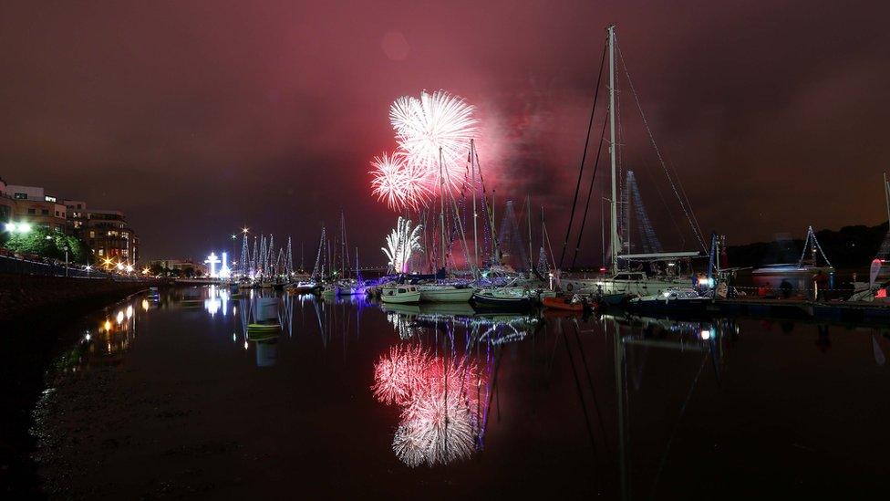 fireworks above boats