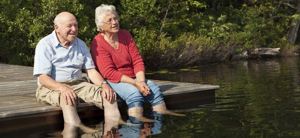 older couple by lake