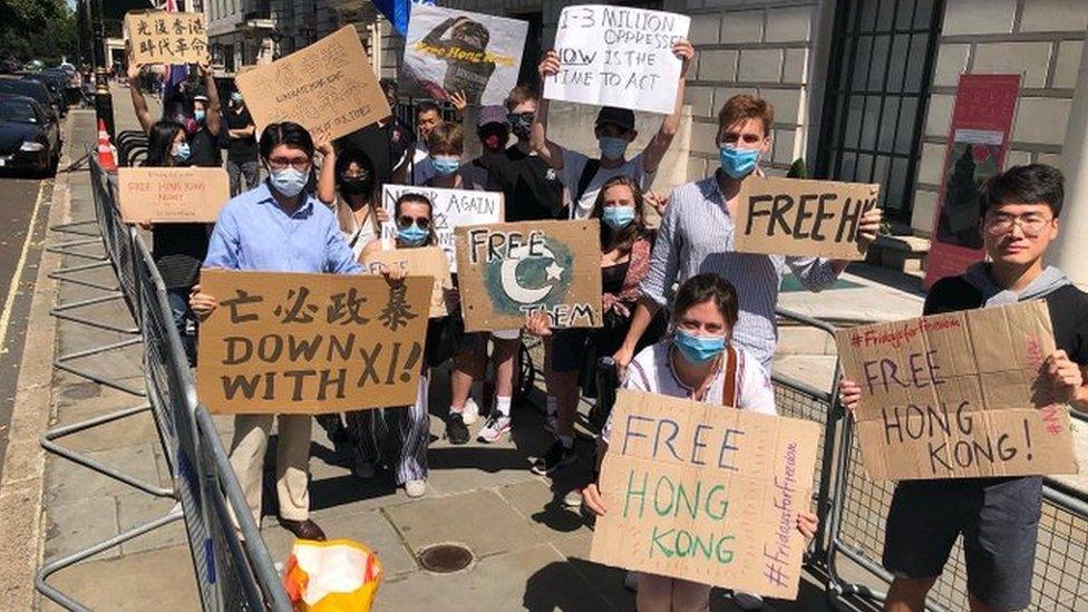 People attend a protest organised by NOW! during the coronavirus outbreak