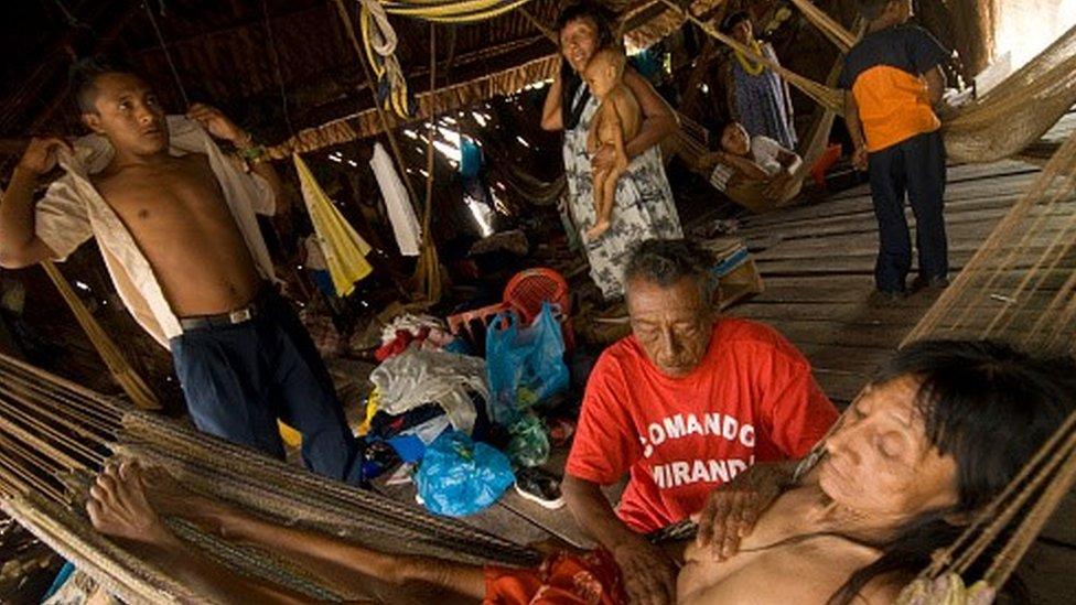 Warrau woman receiving treatment from a local shaman