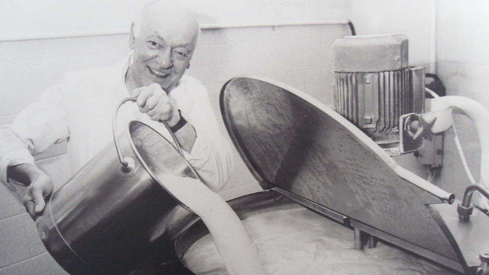 Luigi Cascarini pouring milk into a machine