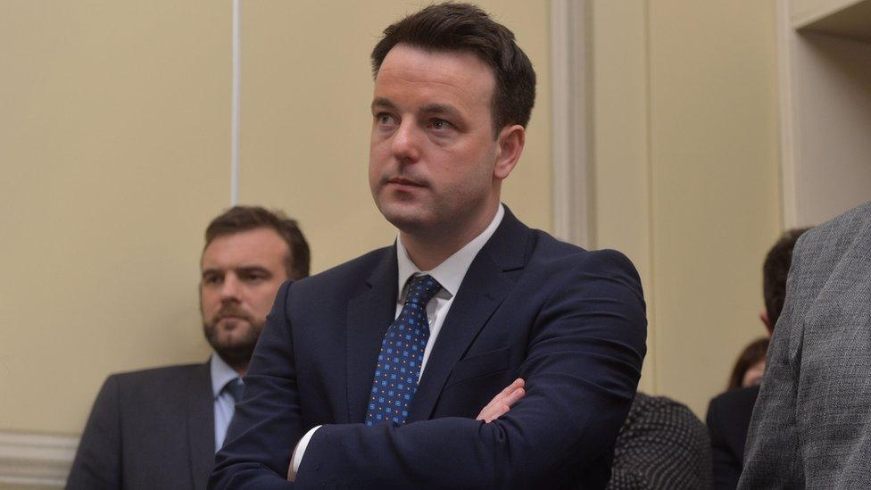 Colum Eastwood listens to Alasdair McDonnell give his leadership speech at the SDLP conference