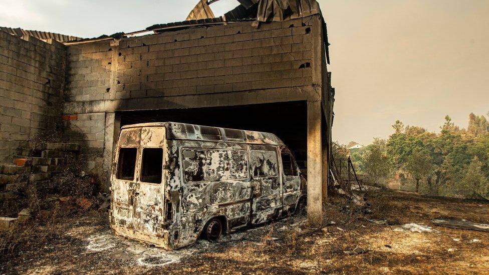 A burnt car on a carpentry company at Ansiao in Leiria Portugal