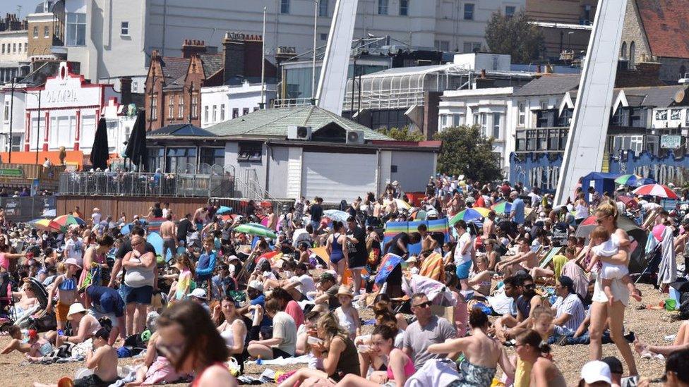 Crowds gather to enjoy the warm sunny weather on Jubilee beach on May 31, 2021 in Southend