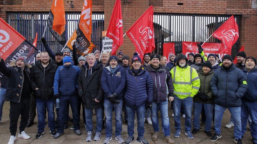 Striking workers on a picket line at Translink's Europa Bus Station in Belfast on Friday