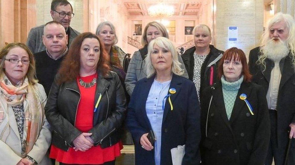 Margaret McGuckin from the group SAVIA pictured with survivors of abuse who went to Stormont on Friday