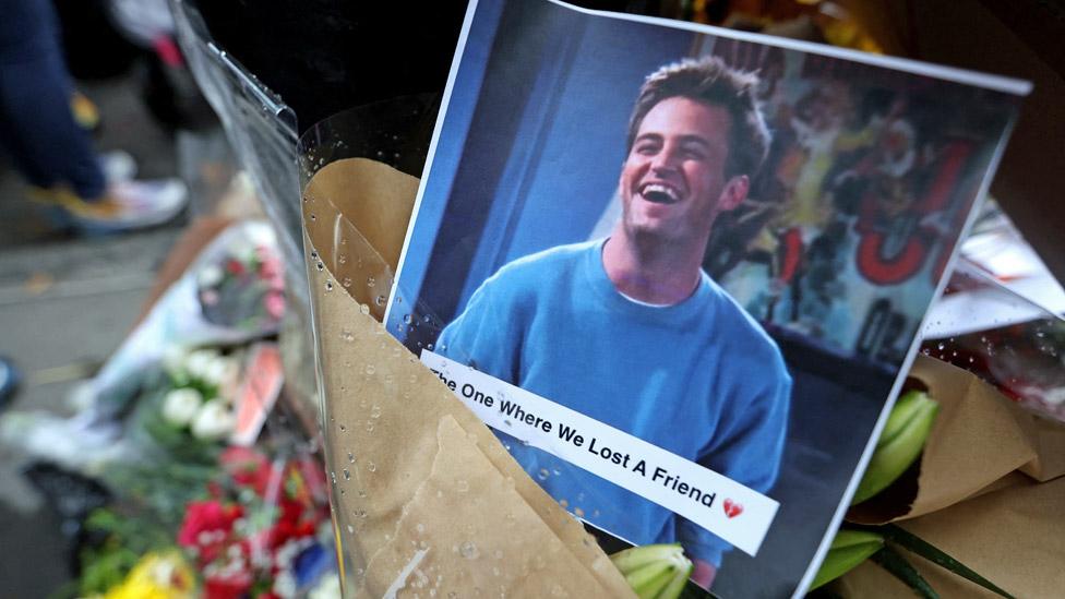 A makeshift memorial for actor Matthew Perry, the wise-cracking co-star of the 1990s hit television sitcom "Friends," who was found dead at his Los Angeles home October 28, is pictured on Bedford Street in Manhattan in New York City