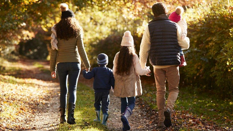 family-walking-forest.