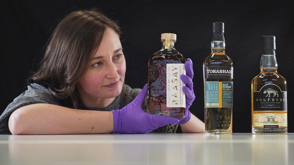 Laura Scobie with some of the whisky bottles in the new collection