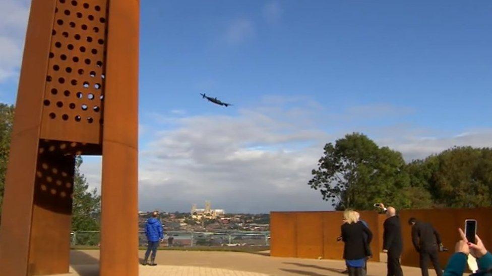 Bomber Command spire with Lancaster bomber flying past