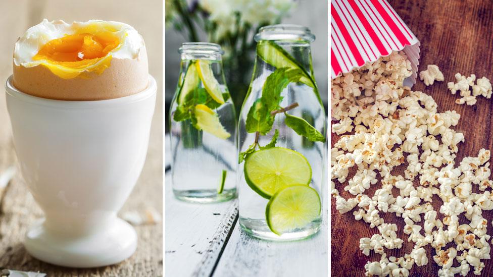 hardboiled egg, water with lime and popcorn