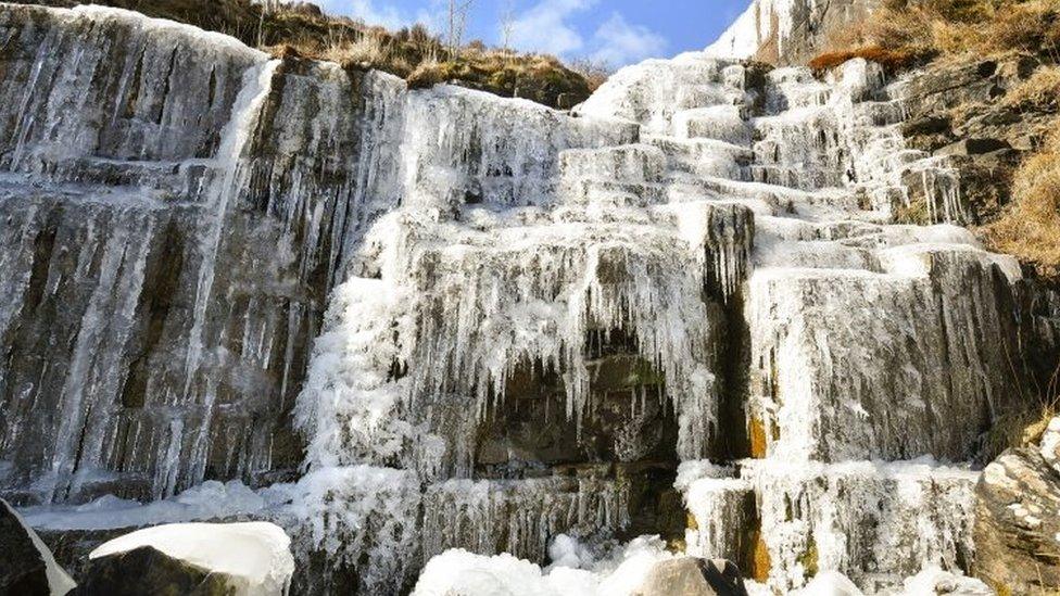 Icicles formed on a frozen waterfall near Pen y Fan mountain on Brecon Beacon National Park, Wales,