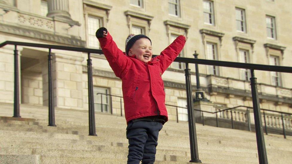 Dáithí MacGabhann on the steps of Stormont after the bill passed