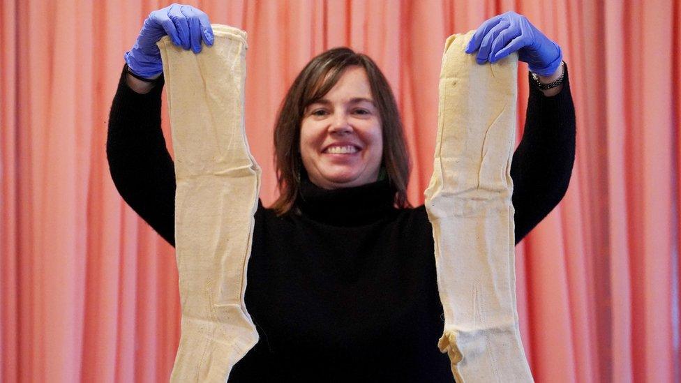 Senior Conservation Manager for Imaging Sarah Noble views 200-year-old samples of fine women’s knee length woollen stockings which were found in a parcel among a stash of 19th-century letters, when opened for the first time at the National Archives in Kew, London.