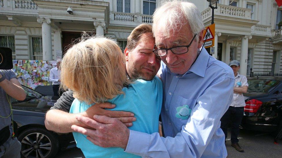 Richard Ratcliffe, the husband of detained Nazanin Zaghari Ratcliffe, is embraced by his mother and father outside the Iranian Embassy in Knightsbridge