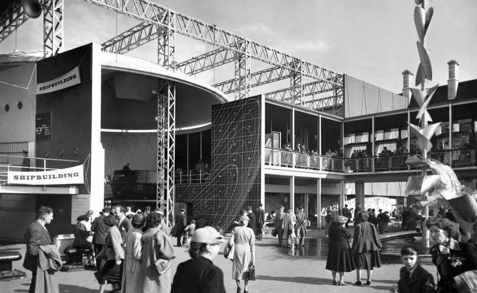 Exterior view of part of the shipbuilding display at the Festival of Britain. On the left is the Power and Production Pavilion and on the right the Natural Resources Pavilion.