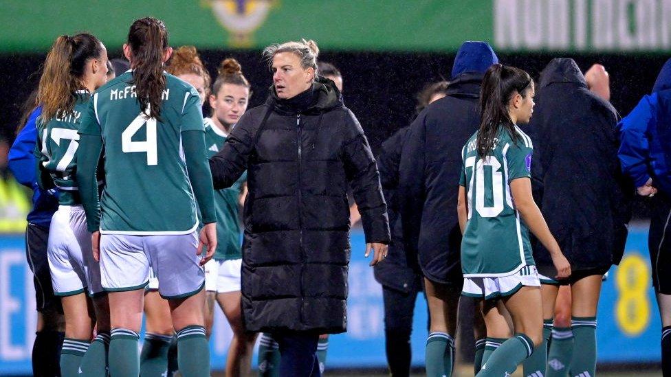 Members of Northern Ireland squad with manager Tanya Oxtoby