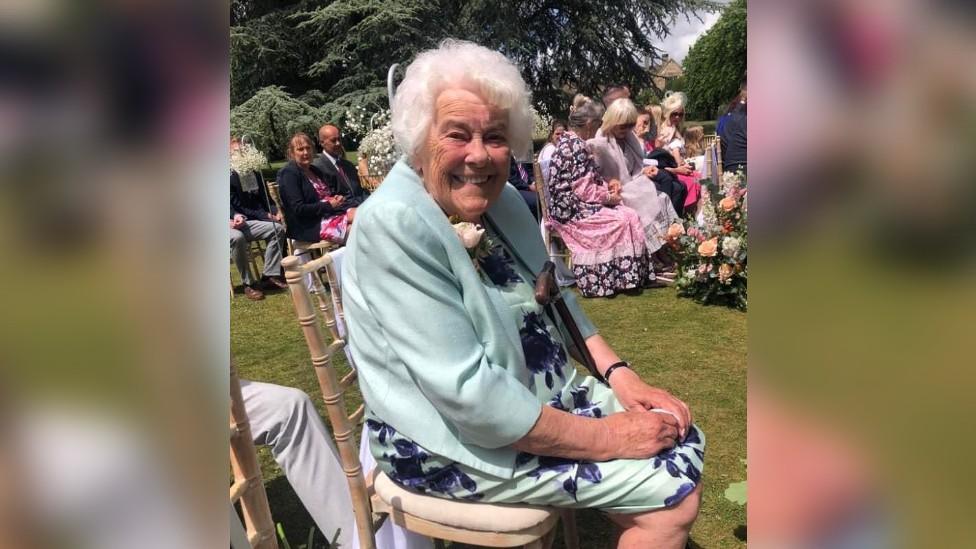 Dotty on a chair at the wedding