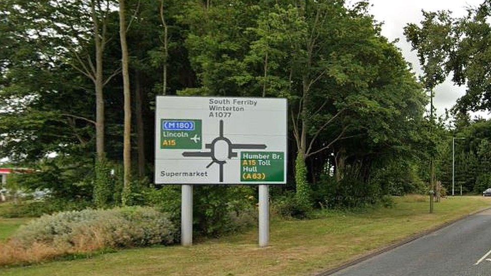 Road sign on A1077